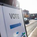 A sign showing people where they should cast their ballots for an election.