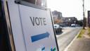 A sign showing people where they should cast their ballots for an election.