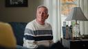 Election worker John "Jay" Schneider sits for a portrait at his home in Downingtown, PA.