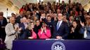 Pa. Gov. Josh Shapiro holds up Senate President Pro Tempore Kim Ward's hand as he signs the first bill of his tenure.