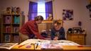 Lauren Zak, a direct support professional for Emmaus Community of Pittsburgh, helps Emmaus resident Diane change her sheets.