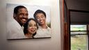 A family photo hangs on a wall in the dining room of Fe and Gareth Hall's home in Stroudsburg.