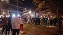 Pennsylvania State Police on horseback try to control a crowd on Penn State's campus.