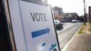 A sign showing people where they should cast their ballots for an election.