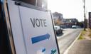 A sign showing people where they should cast their ballots for an election.