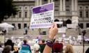 People gather on the steps of the Pennsylvania State Capitol in Harrisburg to honor lives lost to addiction during 2021's Overdose Awareness & Memorial Day.