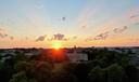 The sun shines over Old Main on Penn State’s University Park campus.