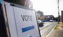 A sign showing people where they should cast their ballots for an election.