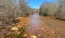 A stream along Coaldale Road in Rush Township, Centre County, runs orange from acid mine drainage.