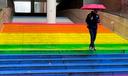 A rainbow-colored staircase mural.