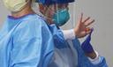 Groups that represent the state’s nursing and long-term care centers say workers need protective equipment like masks, as seen here on a medical worker in Philadelphia.