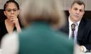 Pennsylvania lawmakers Morgan Cephas (left) and Mark Rozzi (right) listen to a speaker in Philadelphia.