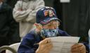 A voter studies a provisional ballot while filling it out in South Philadelphia on Election Night 2020. As of Thursday morning, roughly 27,500 had been processed and reported to the state, unofficial results show.