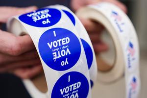 A poll worker holds voting stickers at Central Elementary School in Allentown, Lehigh County, Pennsylvania.