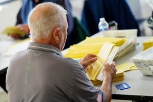 Workers sort mail ballots on Nov. 7, 2023, at Northampton County Courthouse in Easton, Pennsylvania.