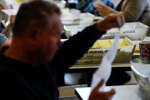 Workers sort mail ballots at Northampton County Courthouse in Easton, Pennsylvania on Nov. 7, 2023.