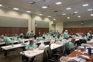 Poll workers process mail ballots in Lancaster County on Nov. 8, 2022.