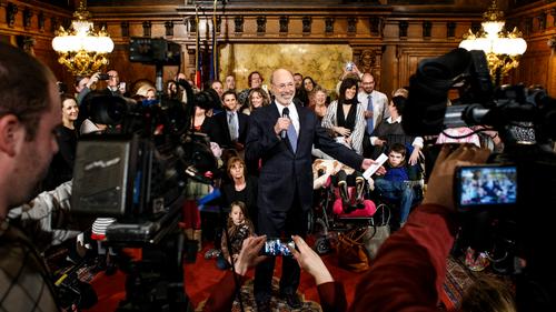 Gov. Tom Wolf speaking in front of cameras.